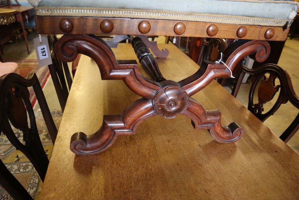 A William IV walnut X frame dressing stool with floral tapestry seat, width 100cm depth 65cm height 46cm